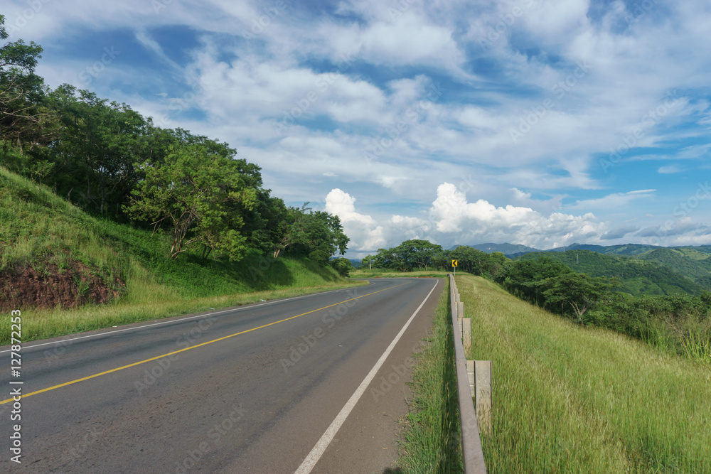 road view with beautiful sky in green mountain, road trip travel concept