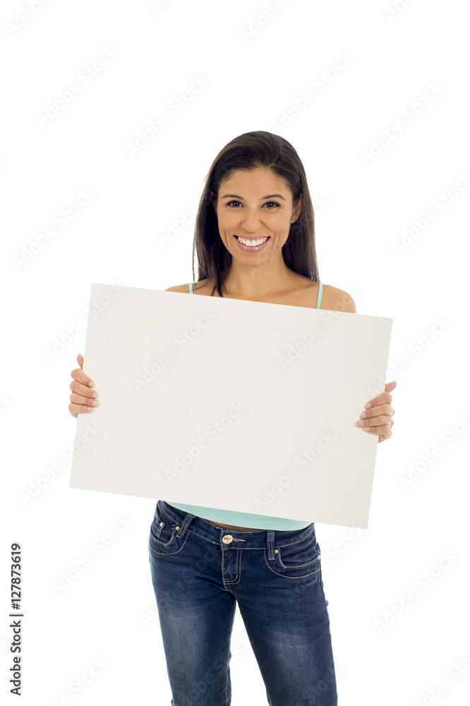 young attractive and happy hispanic woman holding blank billboard with copy space young attractive and happy hispanic woman holding blank billboard with copy space