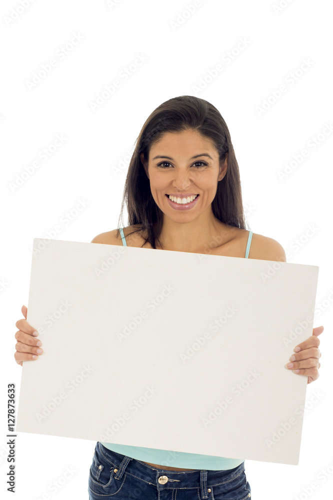 young attractive and happy hispanic woman holding blank billboard with copy space young attractive and happy hispanic woman holding blank billboard with copy space