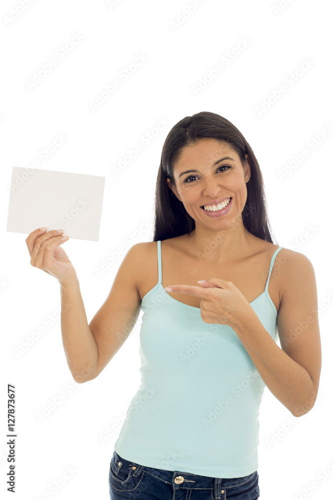 young attractive and happy hispanic woman holding blank card with copy space young attractive and happy hispanic woman holding blank card with copy space