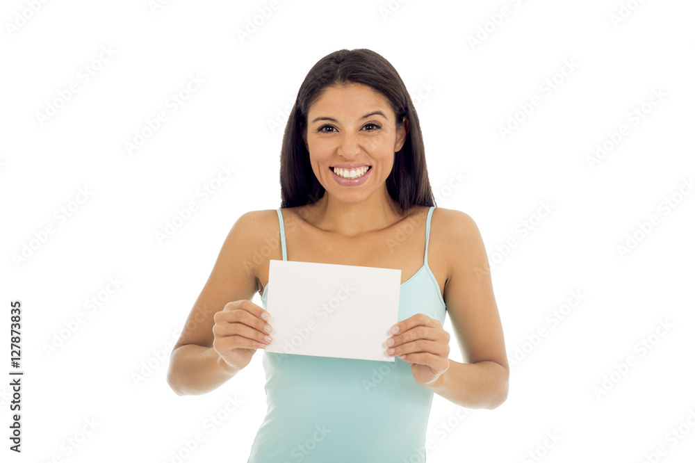 young attractive and happy hispanic woman holding blank card with copy space young attractive and happy hispanic woman holding blank card with copy space