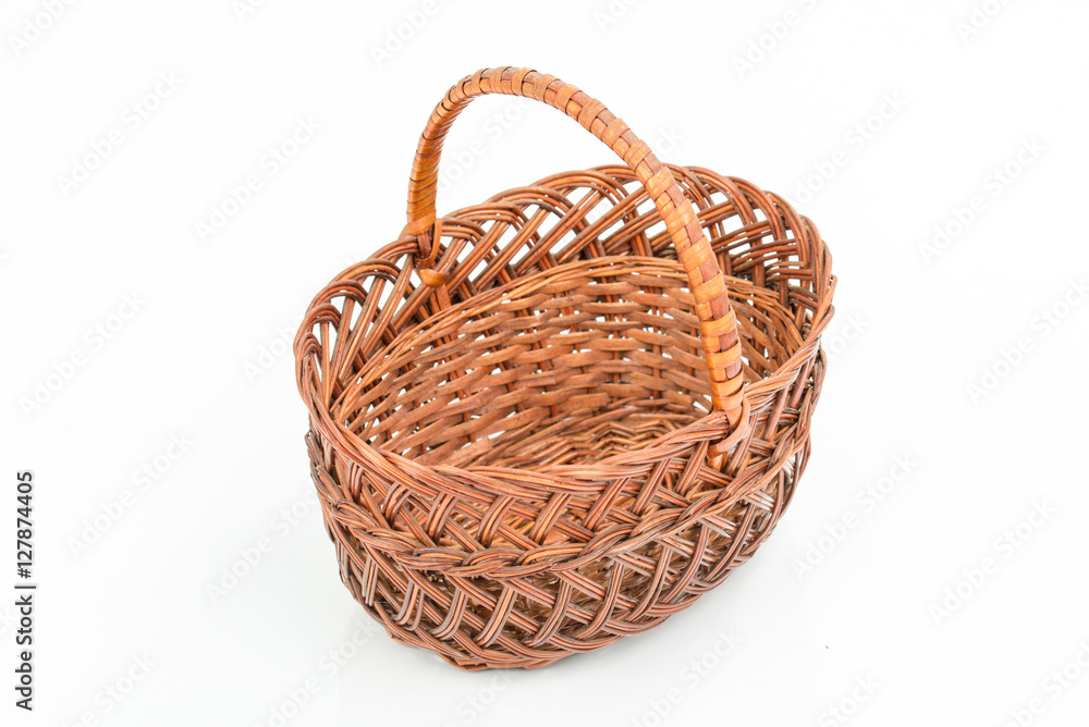 Empty wooden woven fruit/bread basket on white background. Wicker basket. Plaited container. Natural wood (brown) color. Winter, Christmas, New Year,  enterteinment place decoration. Top, side view.