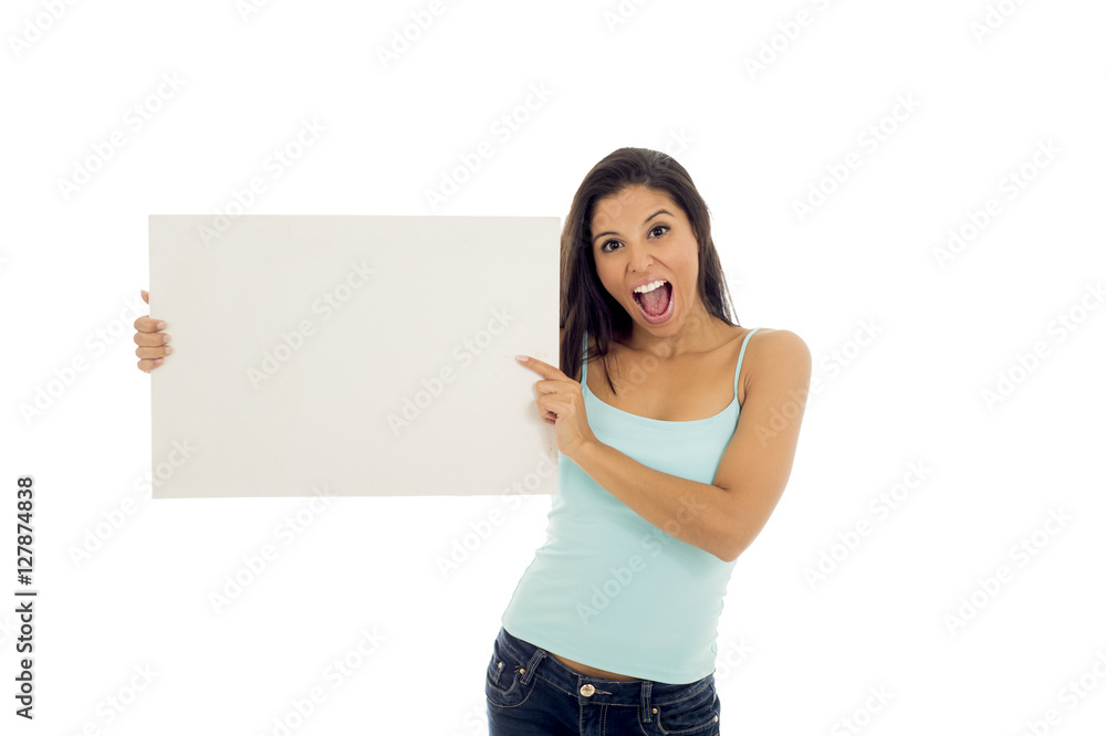 young attractive and happy hispanic woman holding blank billboard with copy space young attractive and happy hispanic woman holding blank billboard with copy space
