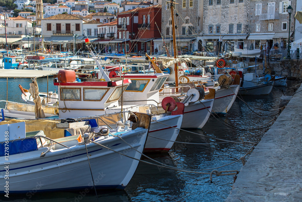 Old boats at the pier of Hydra island, Greece.