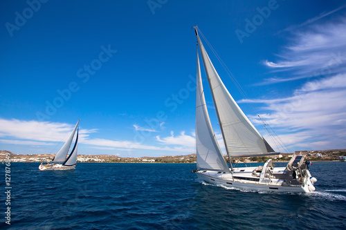 Luxury yachts at Sailing regatta in the wind through the waves at the Mediterranean Sea.