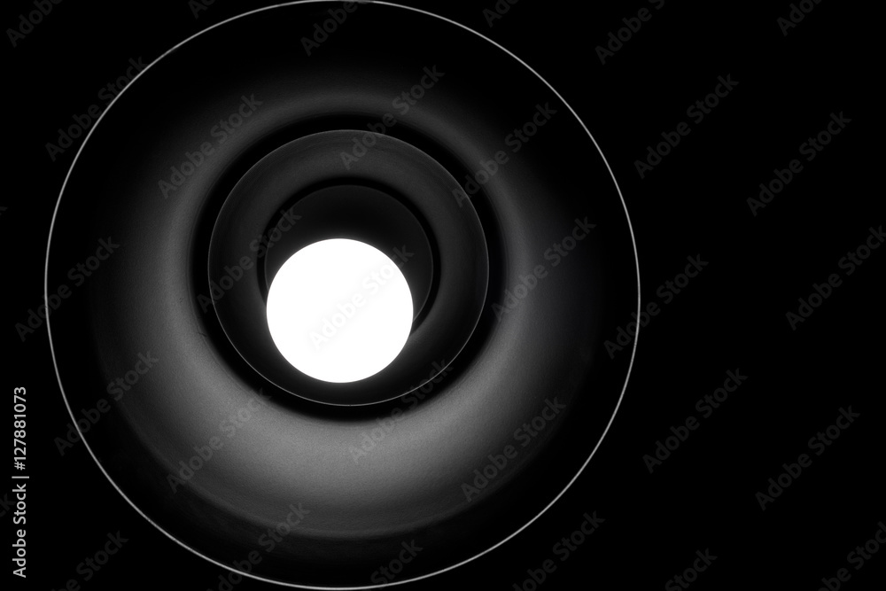 low angle view of illuminated Pendant Light in a dark room. low angle view of illuminated Pendant Light in a dark room.
