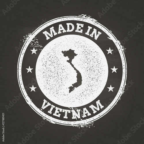 White chalk texture stamp of the Socialist Republic of Vietnam map on a black schoolboard, creating a grunge rubber seal effect.