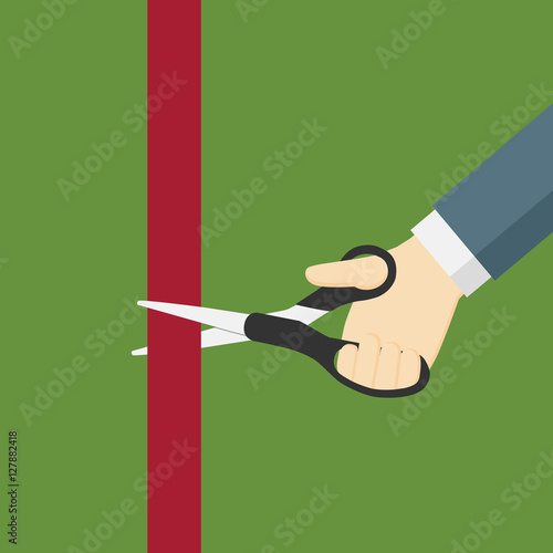 Hand Holding Scissor And Cut Red Ribbon