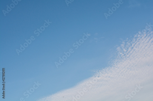Blue sky with beautiful white clouds in sunny day.