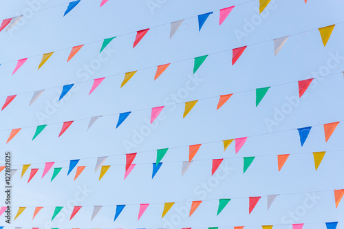 Colorful triangle flags hung across the beautiful blue sky.