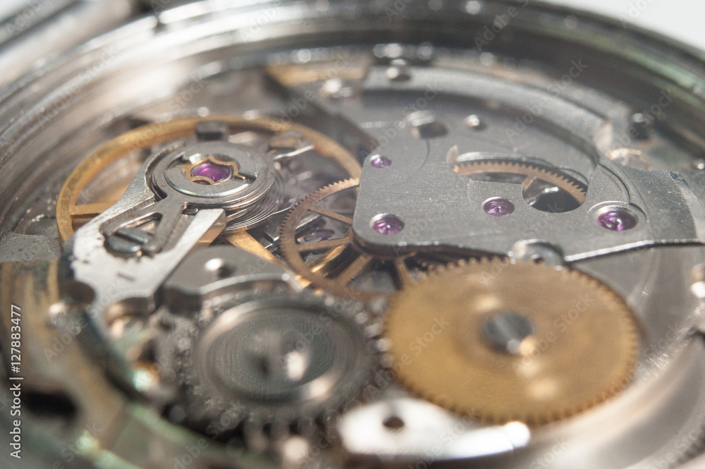 Detail of watch machinery on the table. Detail of watch machinery on the table.