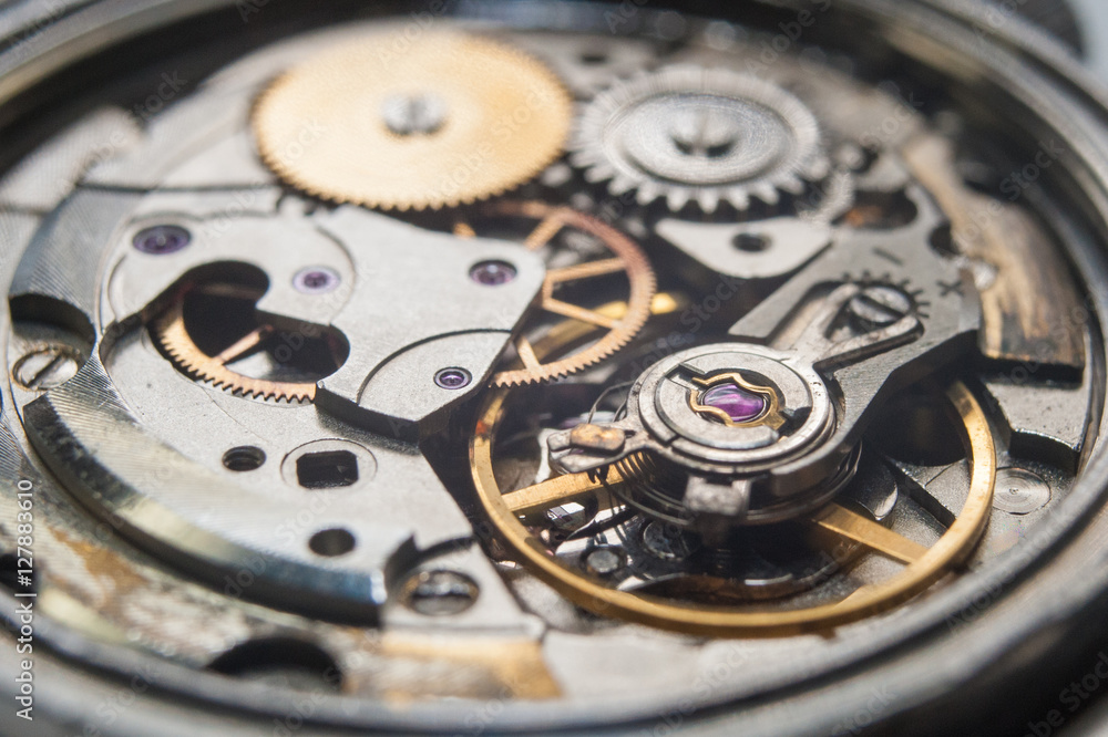 Detail of watch machinery on the table. Detail of watch machinery on the table.