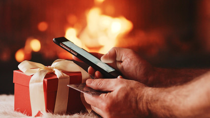 Unrecognizable Man Hands holding Credit Card and Using SmartPhon