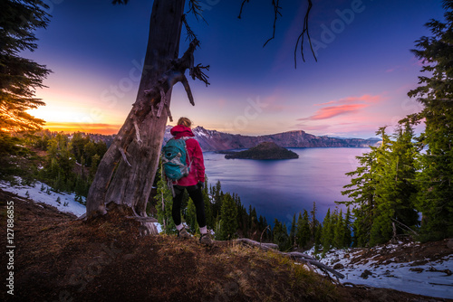 Tourist looking at Crater Lake Oregon Landscape