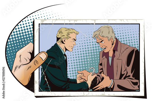 Police handcuffs offender. Hand with photo.