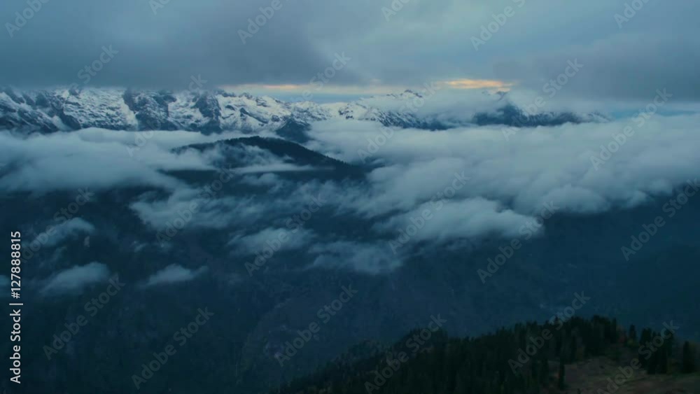 after sunset dusk timelapse in high snowy mountains with clouds after sunset dusk timelapse in high snowy mountains with clouds