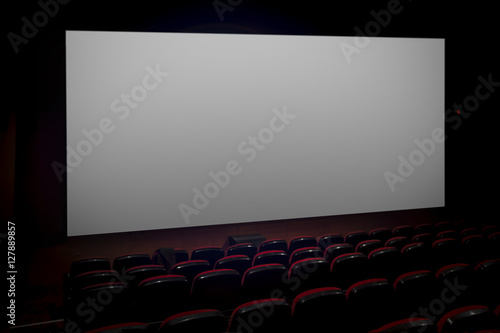 Empty movie theater with blank screen
