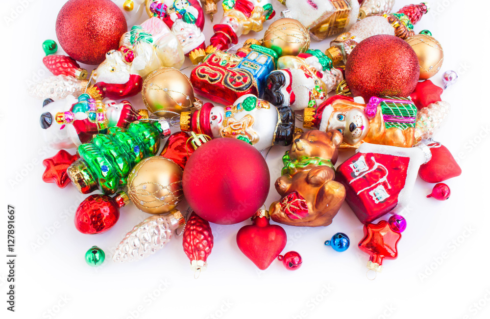 Christmas or New Year background: colored glass balls and toys, decoration on a white background