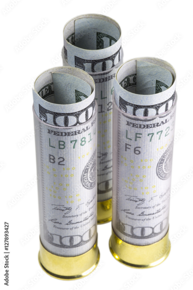 Three 12 caliber shotgun cartridges loaded hundred dollar banknotes. Vertical. Isolated on white background. Three 12 caliber shotgun cartridges loaded hundred dollar banknotes. Vertical. Isolated on white background.
