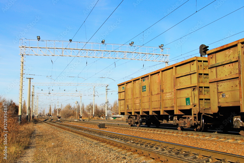 View on the railroad track and cargo trains View on the railroad track and cargo trains