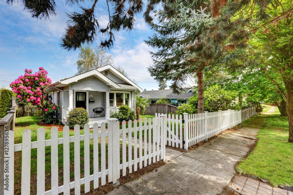 Cute craftsman home exterior with picket fence