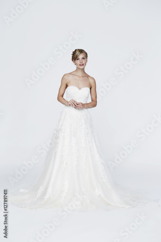 Beautiful blond bride in white studio