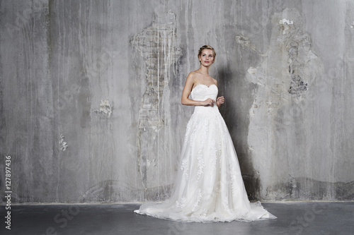 Glamorous bride in white wedding dress, studio