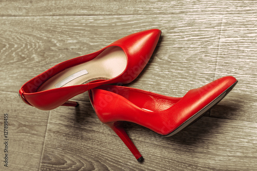 Red women shoes on wooden background