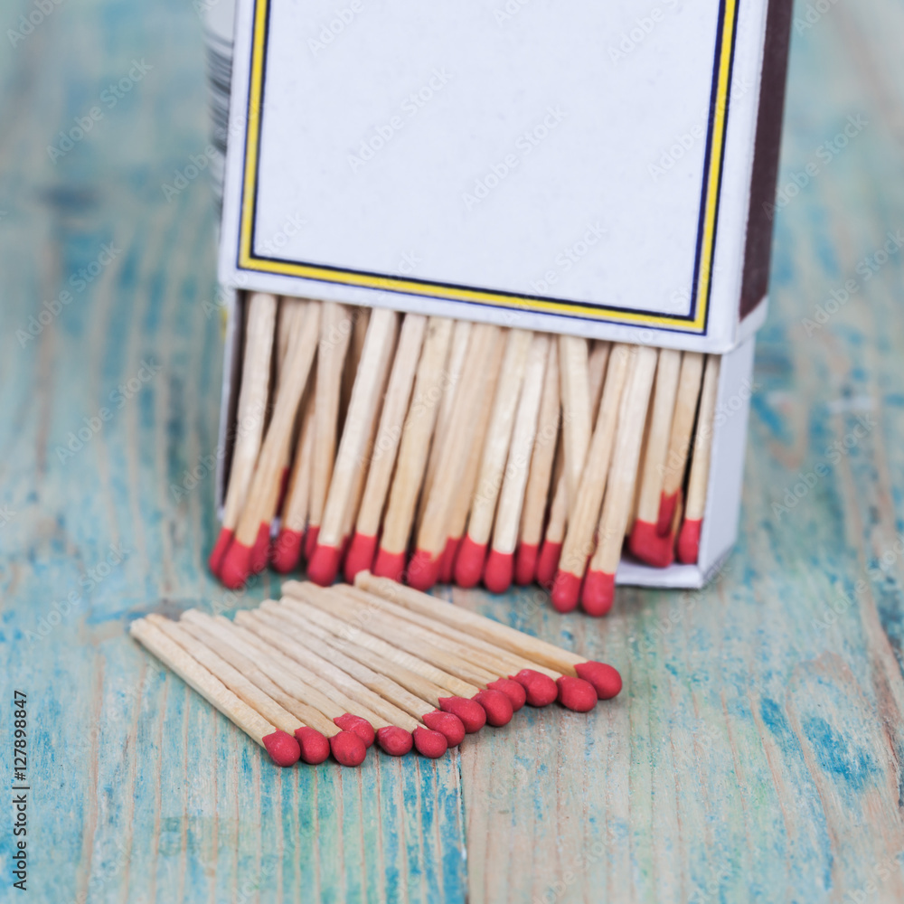 Red Matchbox on color wood background Red Matchbox on color wood background