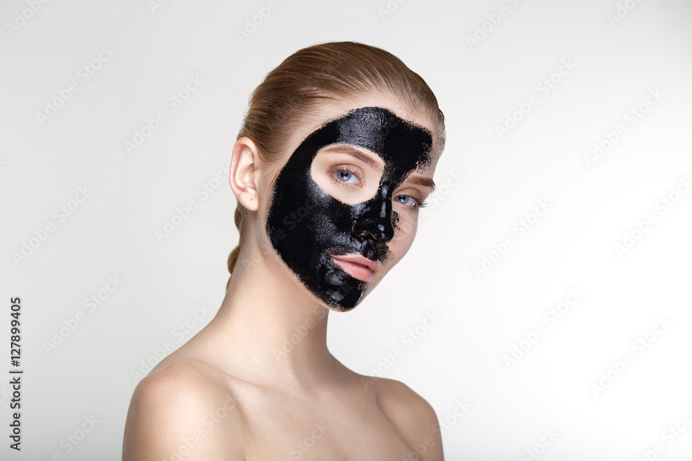 Beauty portrait woman skin care health black mask white background close up