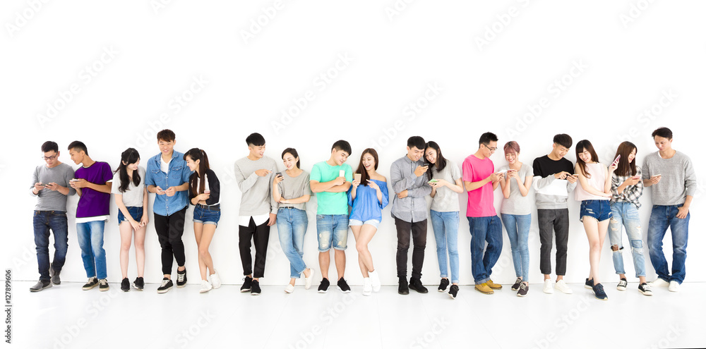 happy young student Group watching smart phone happy young student Group watching smart phone