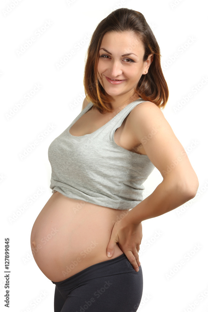 Young happy pregnant woman, isolated on white background Young happy pregnant woman, isolated on white background