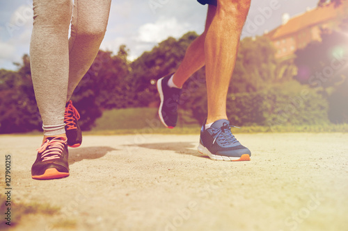 close up of couple running outdoors
