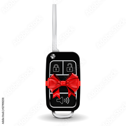 Car key wrapped with red ribbon