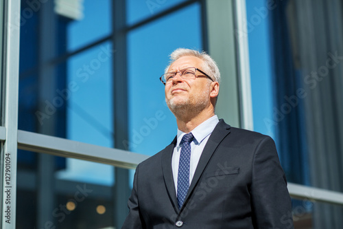 senior businessman on city street