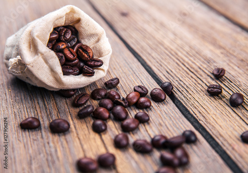 Photography Coffee beans on the wooden background. Hot drinks.