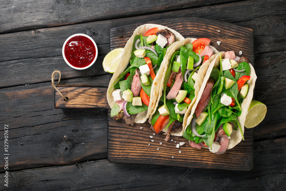 Tortilla wraps with grilled beef meat, spinach, avocado, tomato, Tortilla wraps with grilled beef meat, spinach, avocado, tomato,