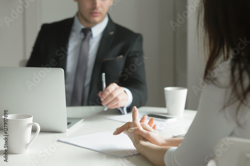 Fotografia Close up of business people hands hold at an office desk, young man and woman are having a business talk