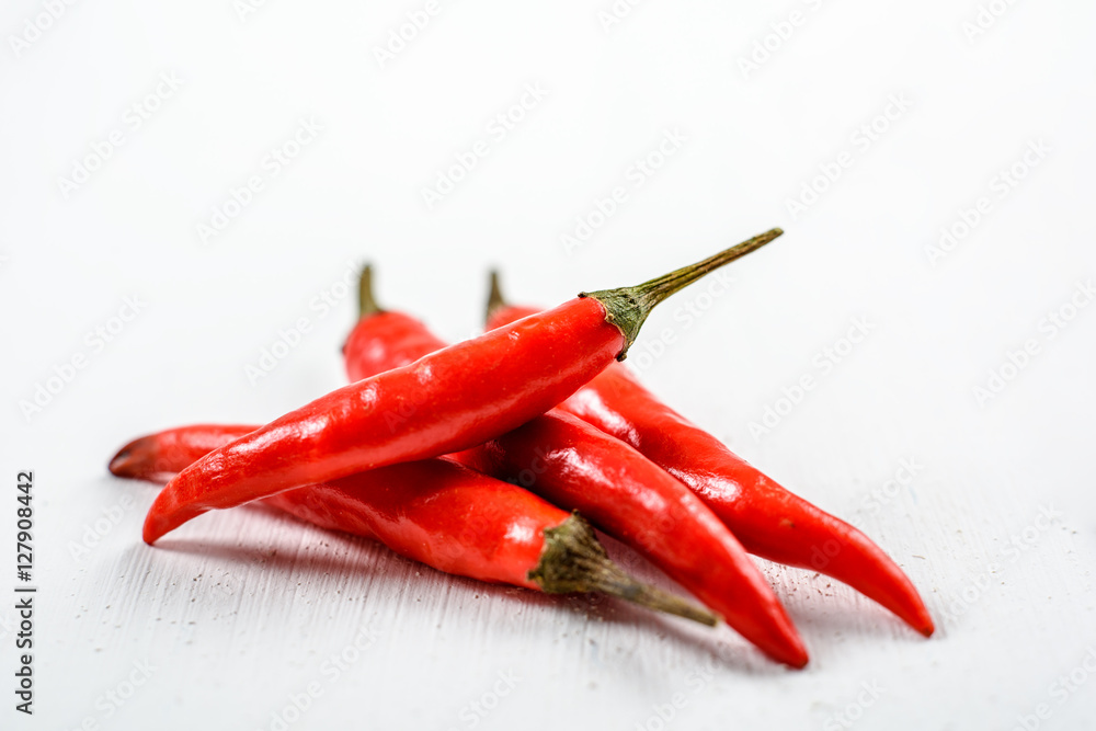 Red Chili Peppers On White