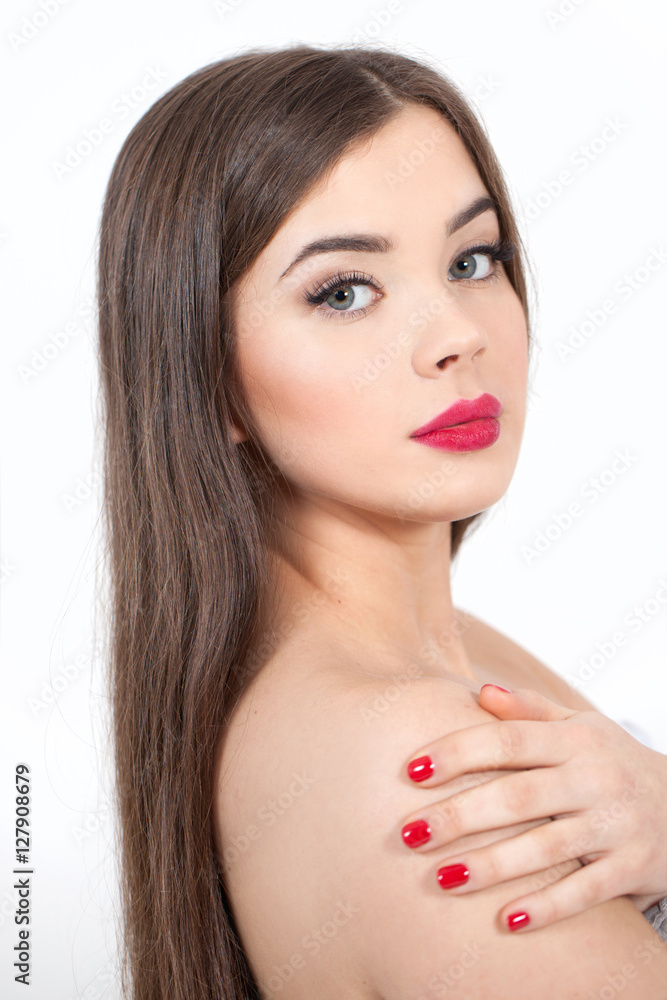 Beautiful Young Woman with Fresh Clean Skin touch own face. Red lips, red lipstick. Cosmetology, beauty and spa. Beautiful Young Woman with Fresh Clean Skin touch own face. Red lips, red lipstick. Cosmetology, beauty and spa.