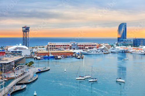 Barcelona cruise port, public promenade and cable car over Barceloneta at sunset photo