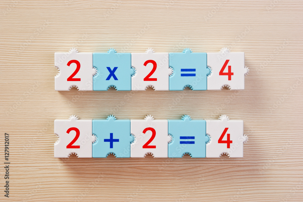 Educational blocks with math problems on the table Educational blocks with math problems on the table
