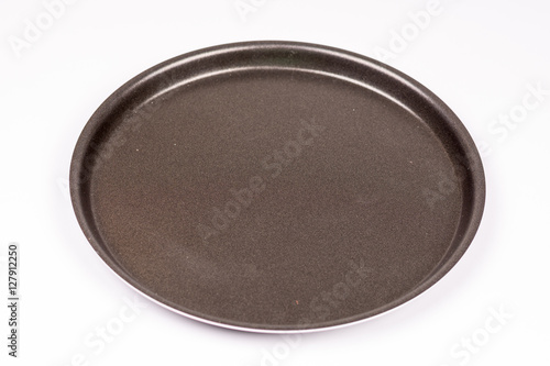 Empty new teflon pan over white background