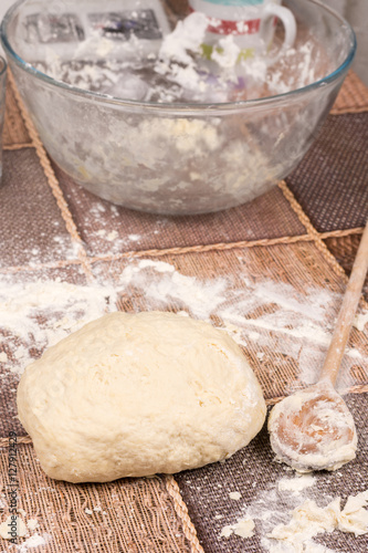 Prepared pizza dough on the table