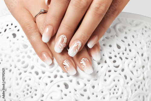 White drawing female nails.
