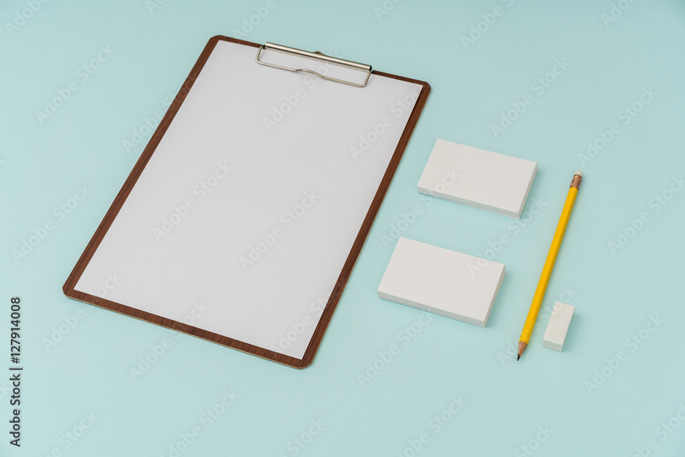 Clip board, paper,pencil and business card on blue background . Clip board, paper,pencil and business card on blue background .