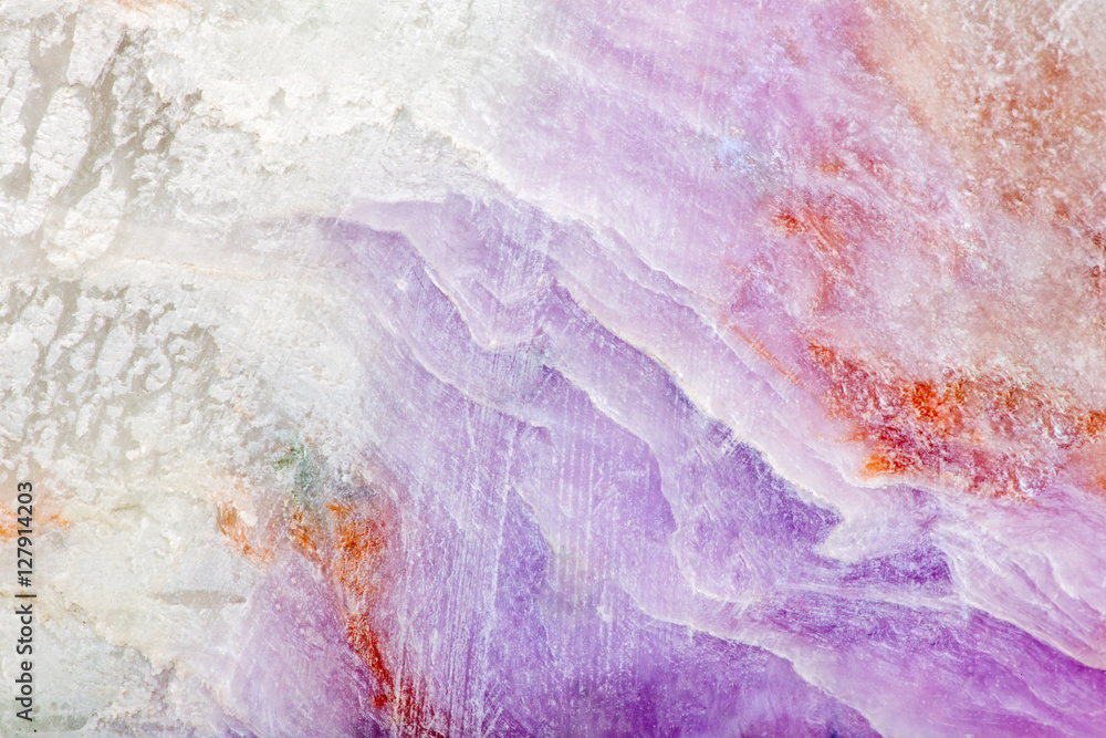 beige and lilac charoite stone background