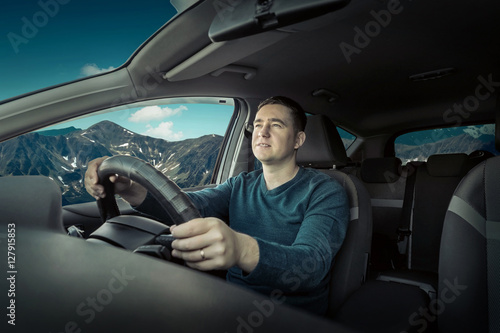 Man sitting and driving in the car