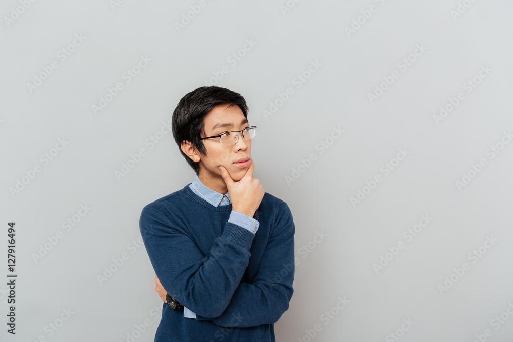 Close up portrait of thoughtful asian man Close up portrait of thoughtful asian man
