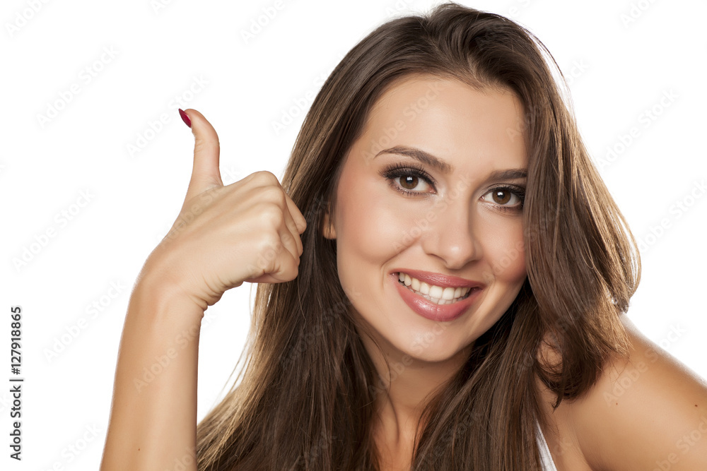 happy young woman showing thimbs up happy young woman showing thimbs up